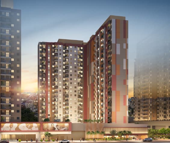 Fachada de condomínio residencial com torres altas e cores variadas.
